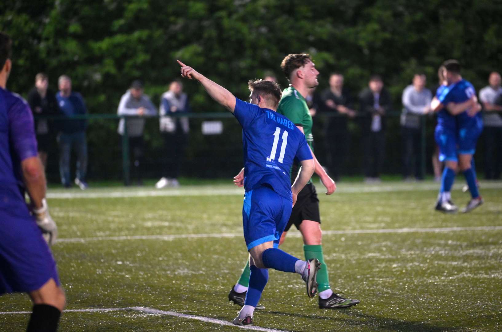 March (Blue) v Blackstones (Green and Black) in the final of the Hinchingbrooke Cup. Ben Seymour-Shove celebrating March's second goal