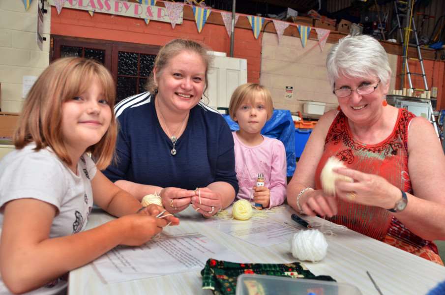 Naomi, Sue and Emily Warren with crochet tutor June Stone.