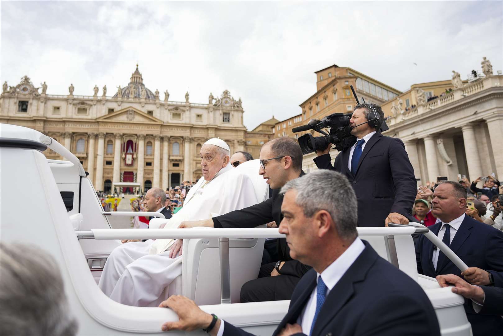 Pope Francis tours St Peter’s Square in his popemobile after his balcony appearance at the end of the Easter Sunday mass (Andrew Medichini/AP)