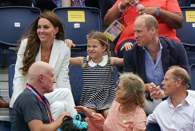 Kate and William with Princess Charlotte seated behind the Earl and Countess of Wessex at the University of Birmingham Hockey and Squash Centre on day five of the 2022 Commonwealth Games in Birmingham (Joe Gidden/PA) (61596354)