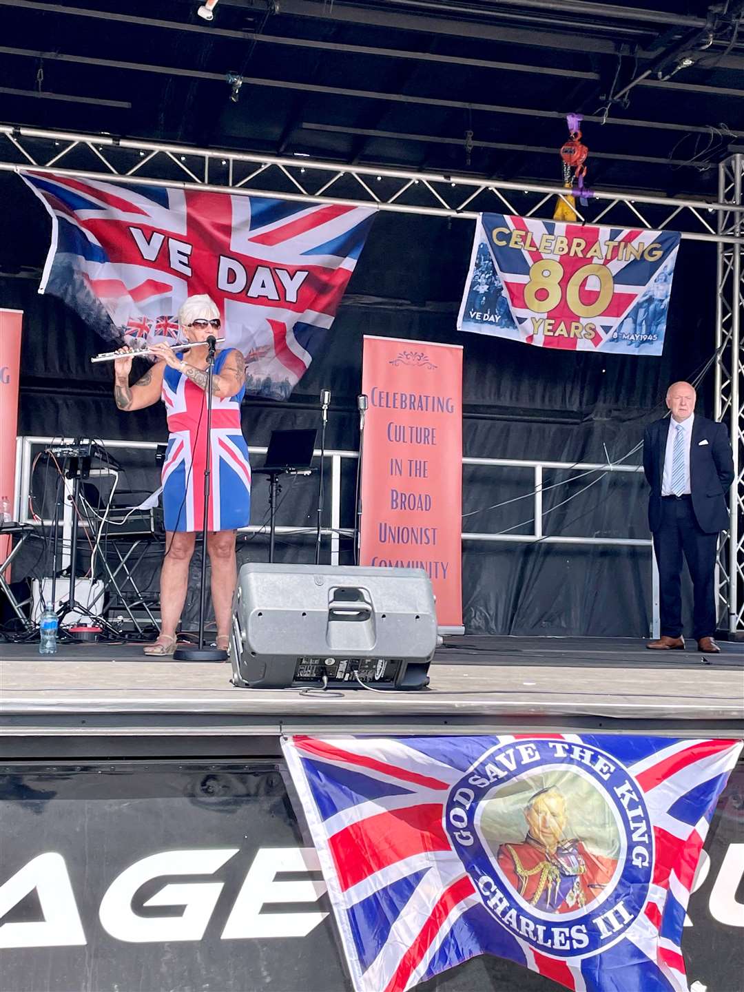 Flautist Jane Watterson takes to the stage during the street party (David Young/PA)