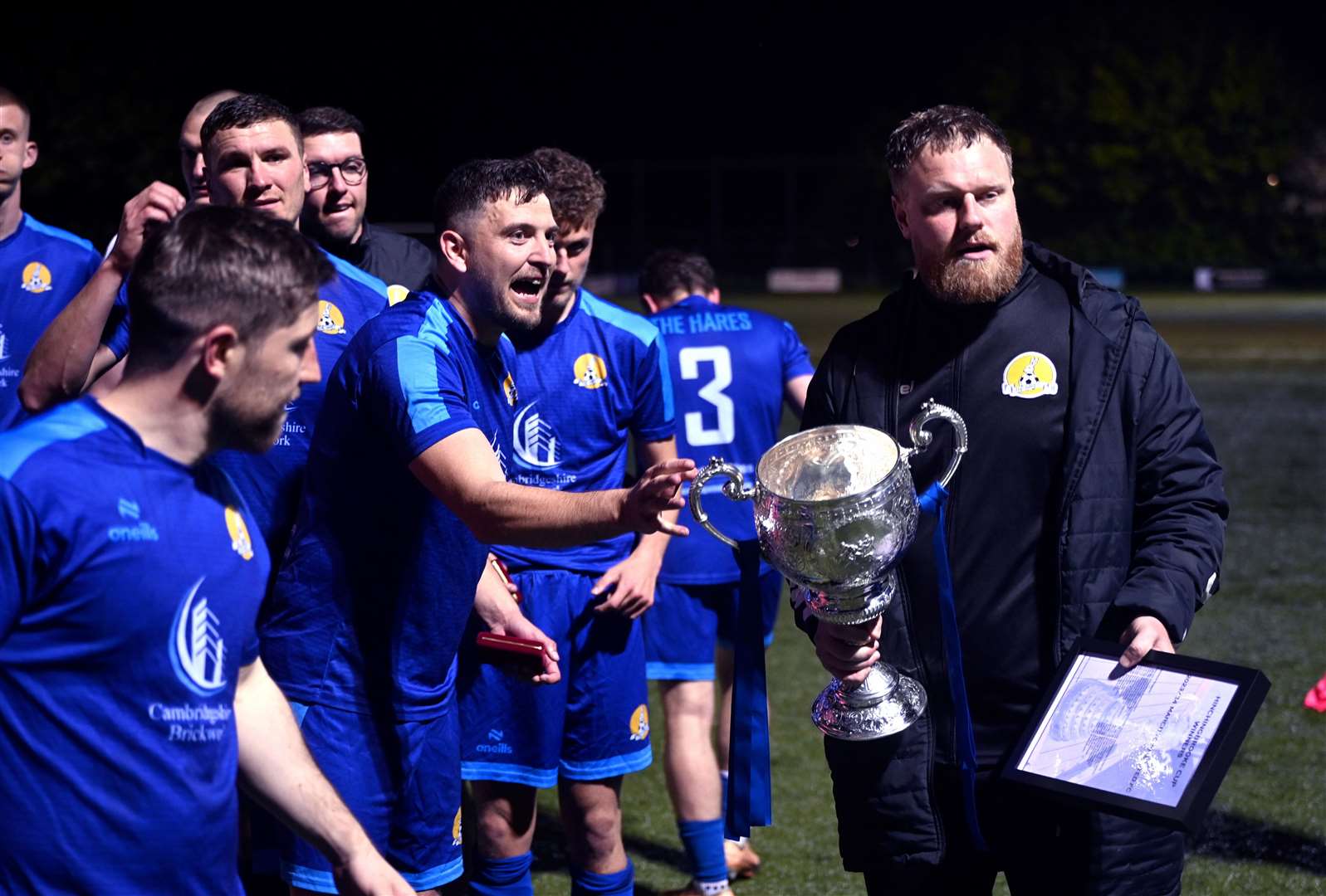 March (Blue) v Blackstones (Green and Black) in the final of the Hinchingbrooke Cup. March celebrate winning the cup