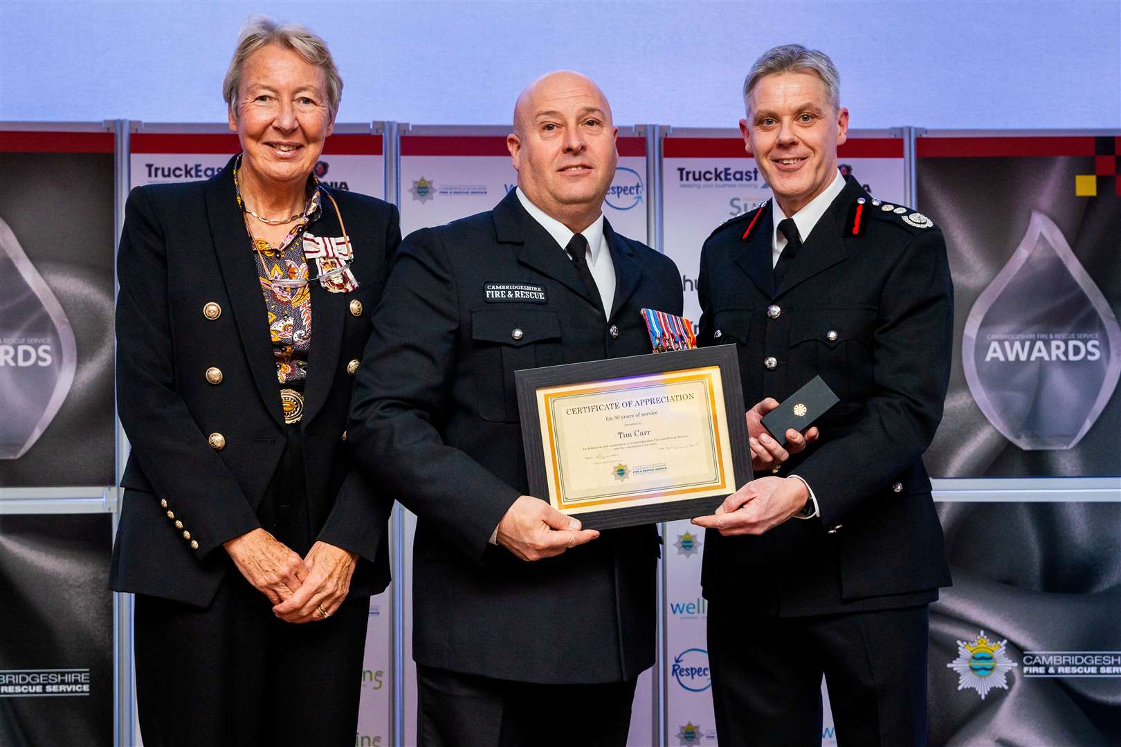 Tim Carr from Wisbech Fire Station receiving a Certificate of Appreciation