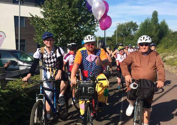 Scott Payne, dressed as Mr Tumble, embarked on a 50-mile charity bike ride to stop people making rude remarks about his autistic son.
