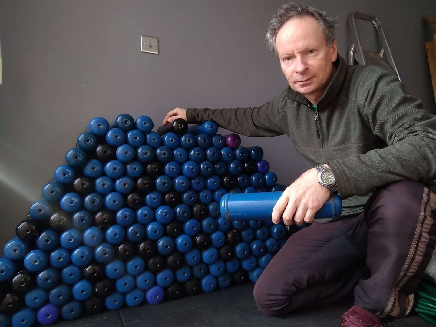 Tim Chapman pictured with half the canisters he has collected from roadsides across the district in the last three months. Picture: Tim Chapman