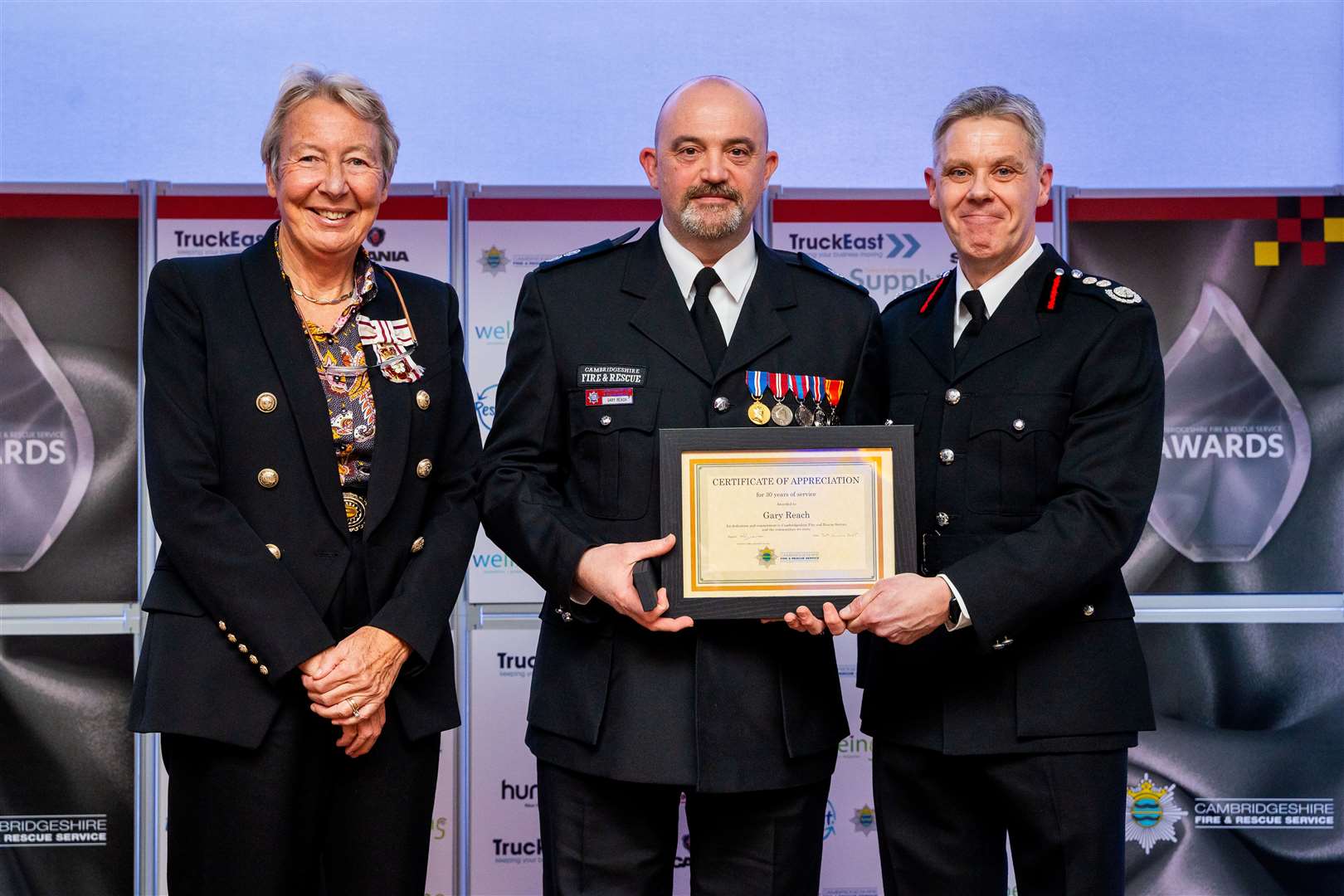 Gary Reach from Wisbech Fire Station receiving a Certificate of Appreciation