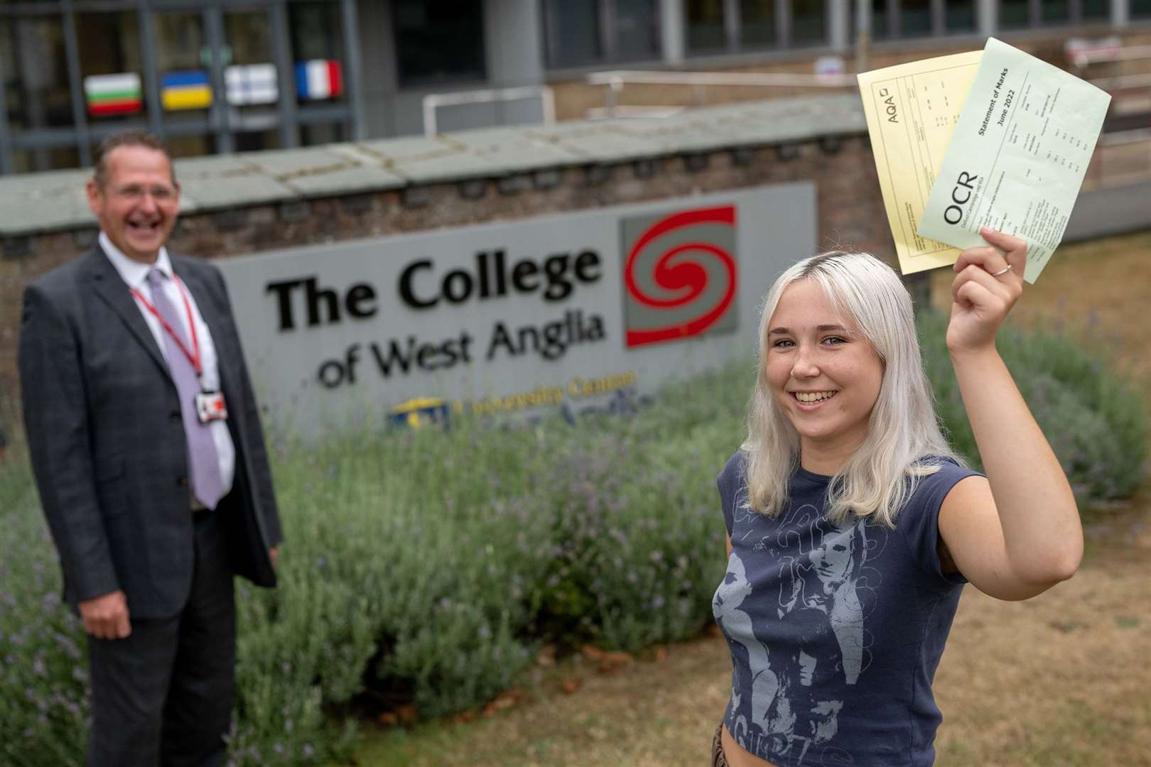 Merry Clift A Level student shows off her results with principal David Pomfret. (58731120)