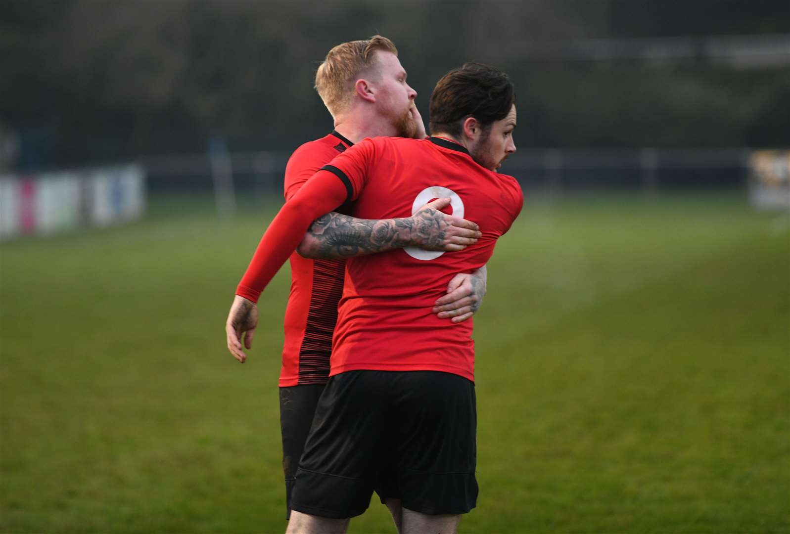 Nick Davey helps Ryan Lennon celebrate his goal.