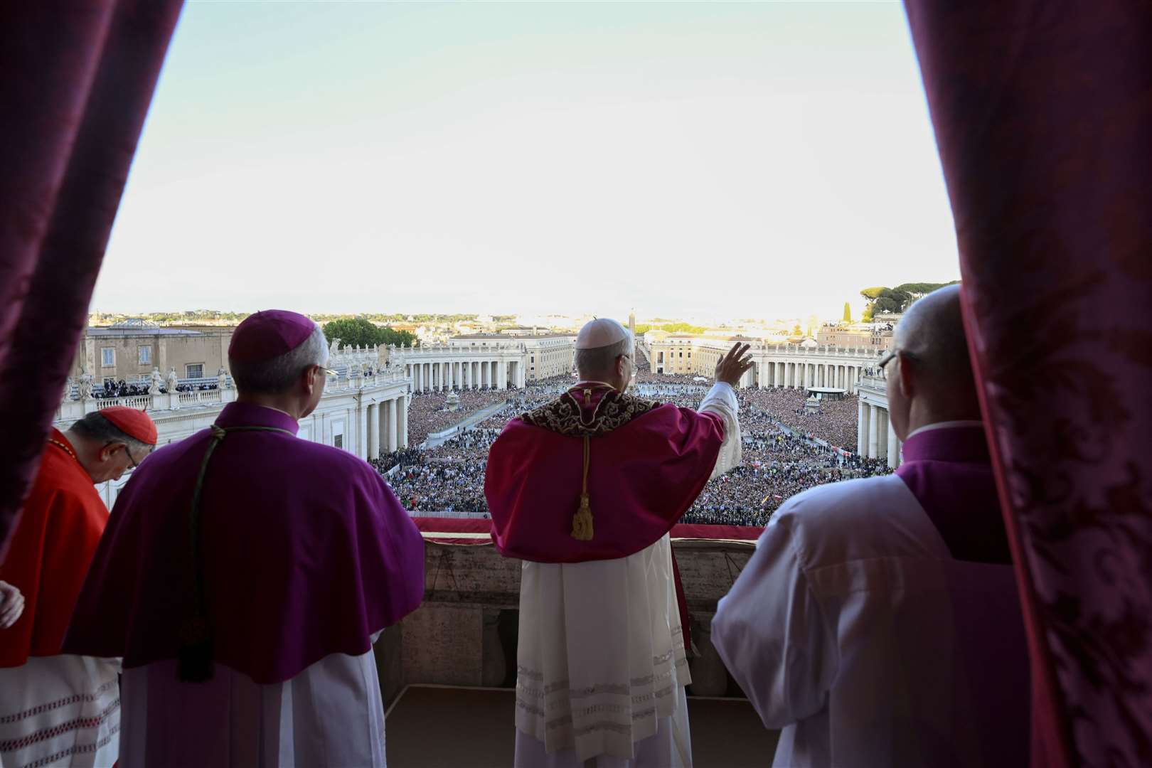 Newly elected Pope Leo XIV waves to faithful and pilgrims gathered in St Peter’s Square at the Vatican shortly after his election (Vatican Media via AP)
