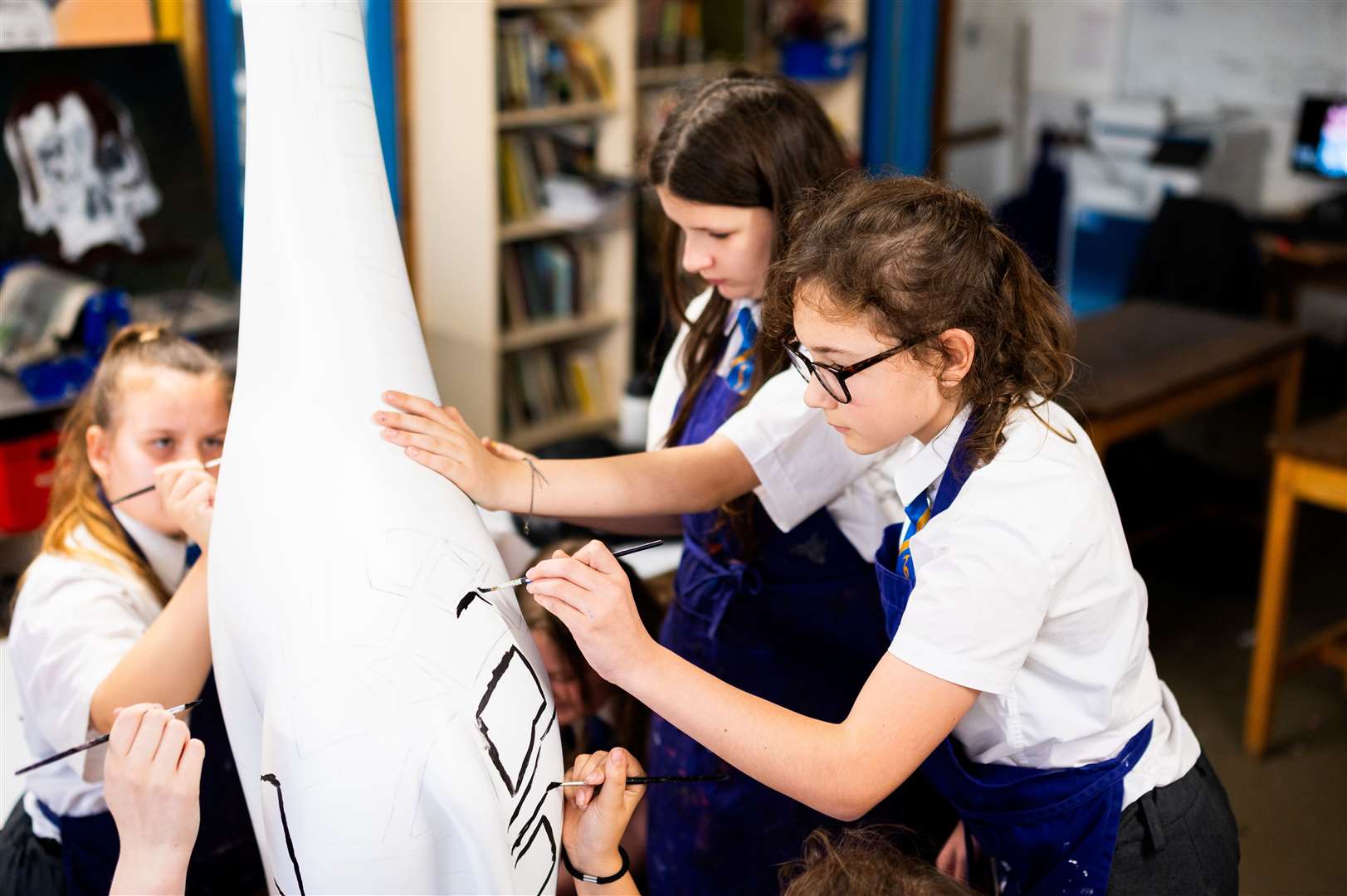 Students have designed and decorated a sculpture of Marsha the giraffe who will be part of the Cambridge Standing Tall exhibition in March. Photo: Barking Dog Media/Ian Burt.