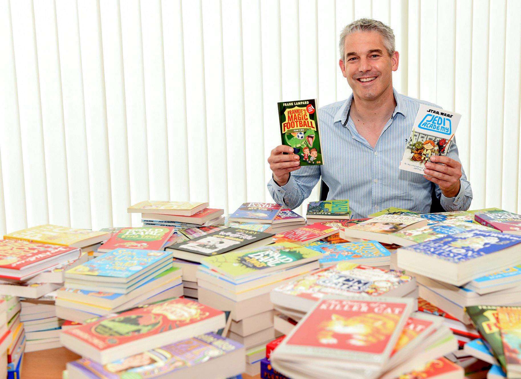 MP Steve Barclay with some of the donated books. (6152679)