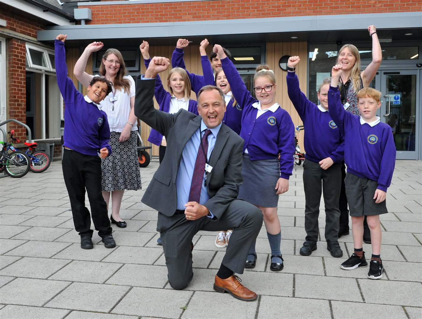 Ramnoth Junior School: Head of schools Sam Miller, executive principal James Ayton and Vice principal Sally Kirby celebrate with pupils (49105389)