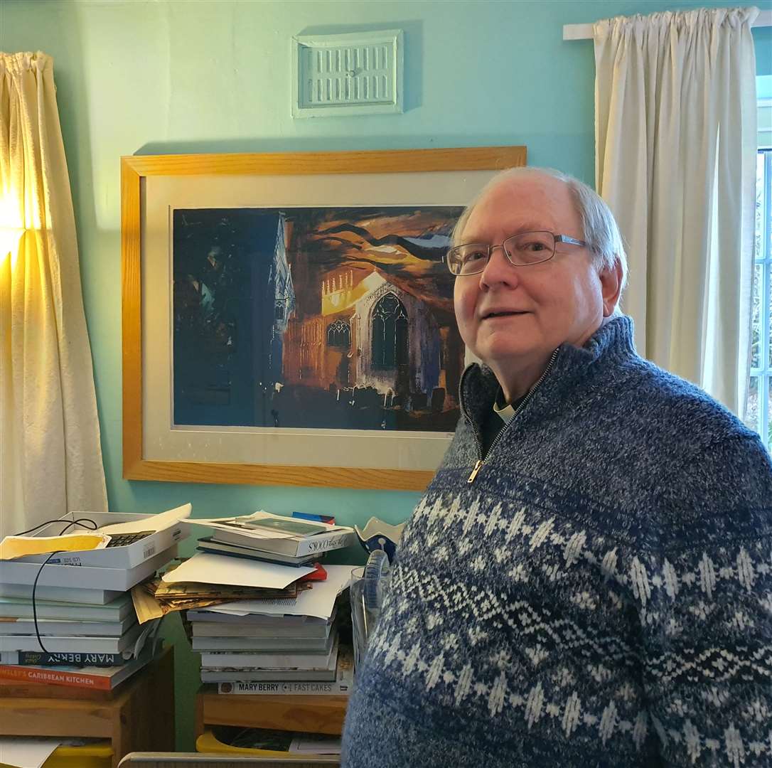 Father Jonathan with a painting of St Mary's Church. PHOTOS: JENNY BEAKE