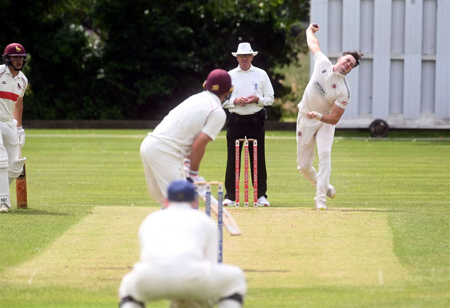 George Bruce bowling for Wisbech against Sudbury