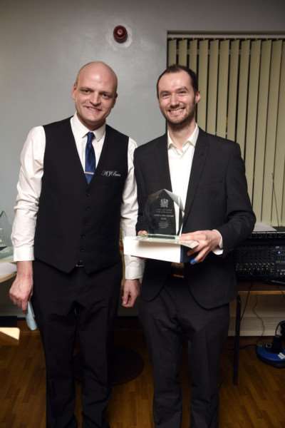 Wisbech's unsung heroes awards night at The Oasis Centre - Matthew Ormiston winner of the Service with a Smile award with Councillor Aigars Balsevics.