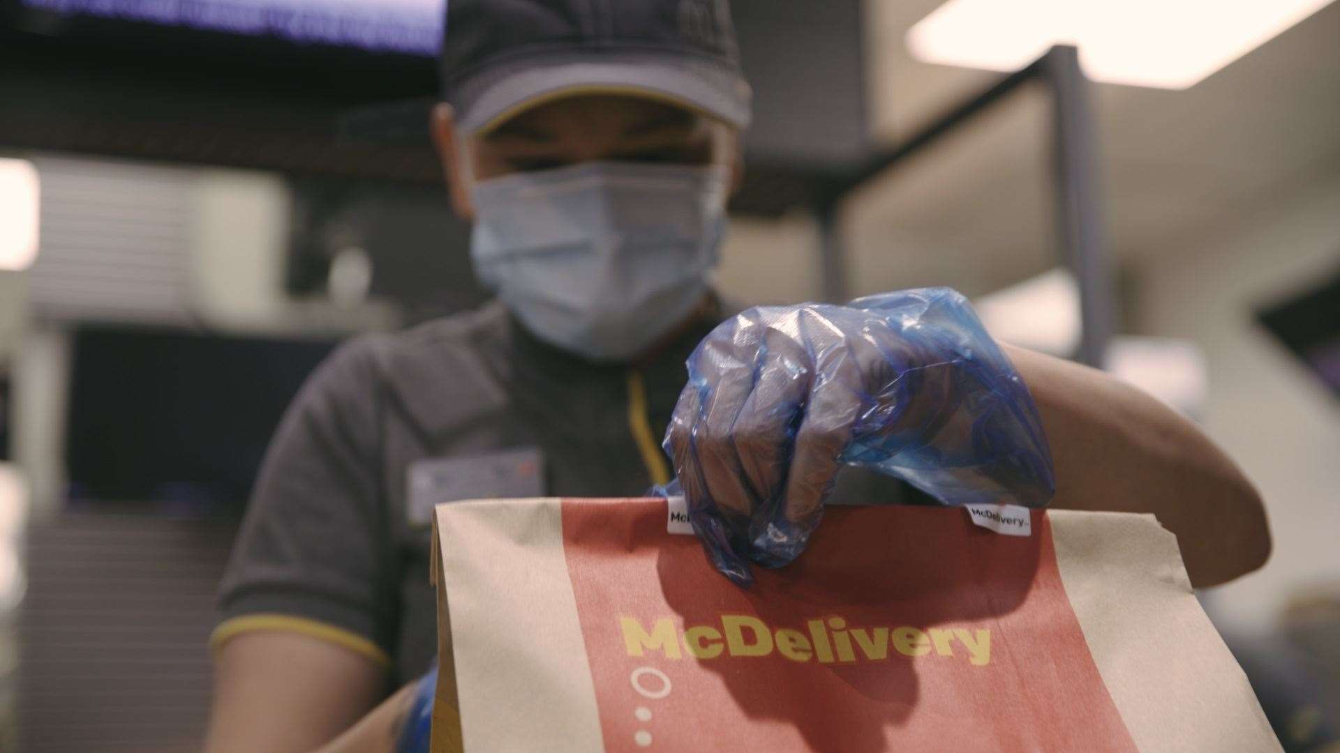 Delight as McDonald's lifts the shutters in Wisbech with staff wearing protective gear to dish the burgers.