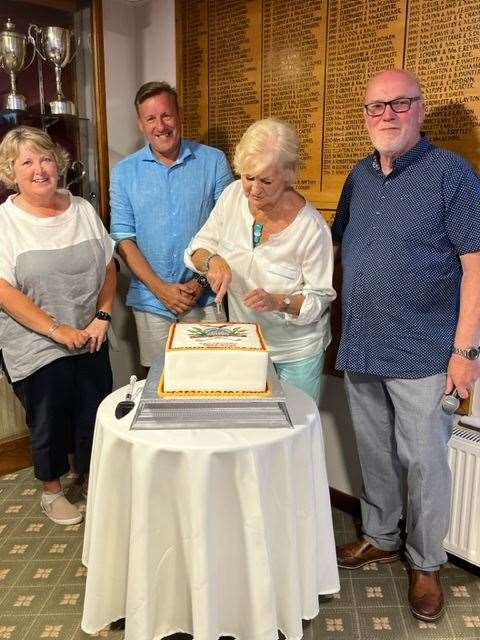 Cutting the celebration cake with club captains Gail Johnson and Steve Durdant-Hollamby, president Carolyn Morton and chairman Barry Chracknell
