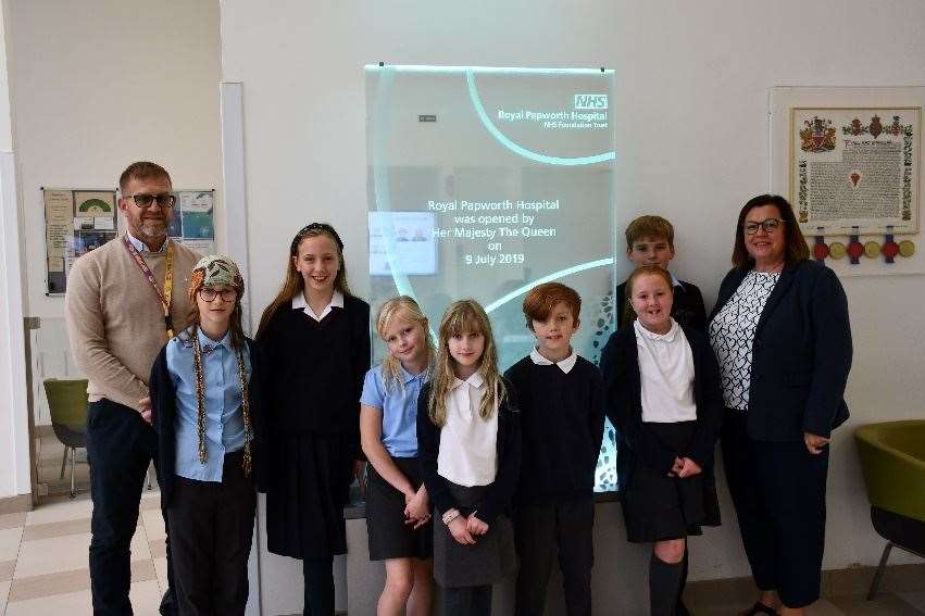 Steve Ely (left), Sonya Ely (right) and school children from Tydd St Mary Primary School