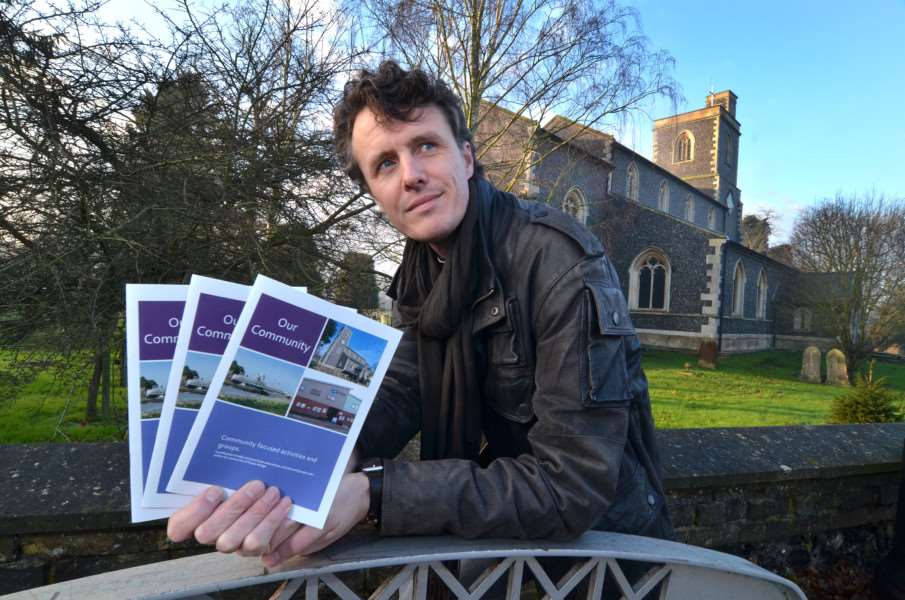 St Matthew's Church, Bridge Road, Sutton Bridge, photo of Rev David Oxtoby with new community brochure, ANL-160120-113306001