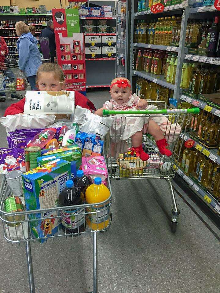 Suzanna, 7 and Larosa Smith, seven months, help with the Trolley Challenge. (5765544)
