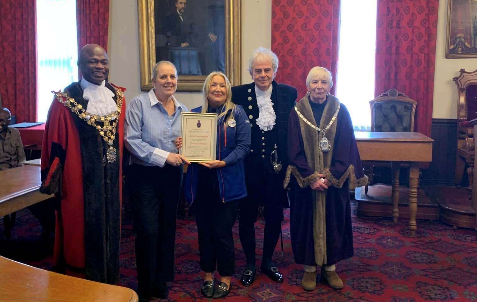 Julie Bushby Tesco Community Champion with her certificate pictured with mayor Cllr Sidney Imafidon, the High Sheriff, David Way, and deputy mayor Janet Tanfield