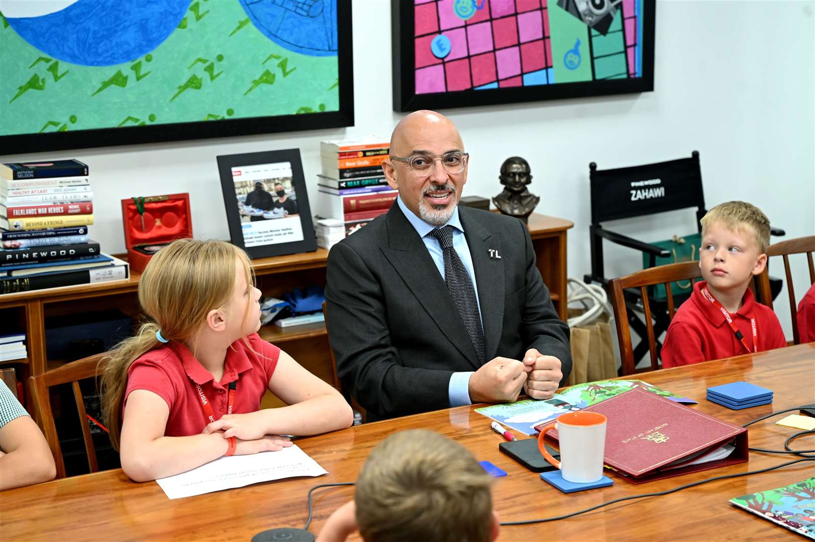 Orchards School visit to Department of Education to show the Secretary of State for Education Nadhim Zahawi a book that has been produced by the school. (57446950)