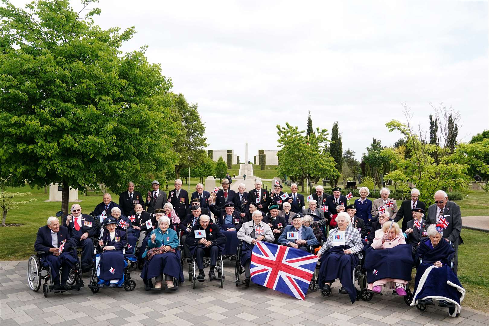 The veterans gathered to have their photograph taken at the National Memorial Arboretum (Jacob King/PA)
