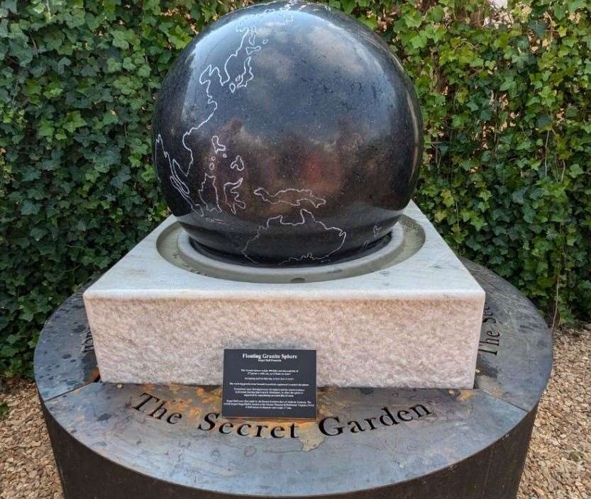 The kugel ball fountain has the map of the world engraved on it.