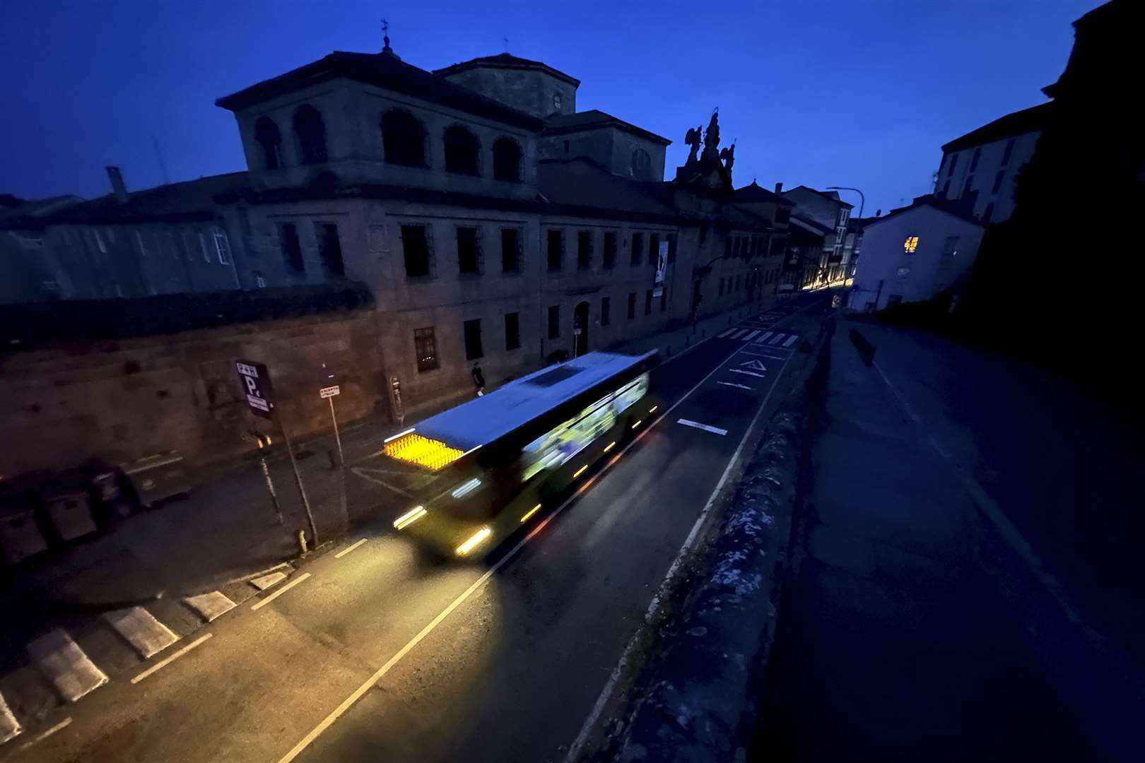 A city bus goes by the historic city of Santiago during a major power outage (Mic Smith/AP)