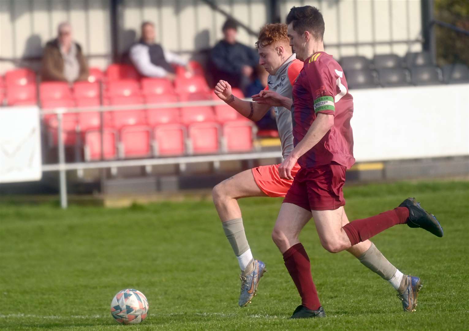 Matteo Perkins being fouled for a penalty for Parson Drove