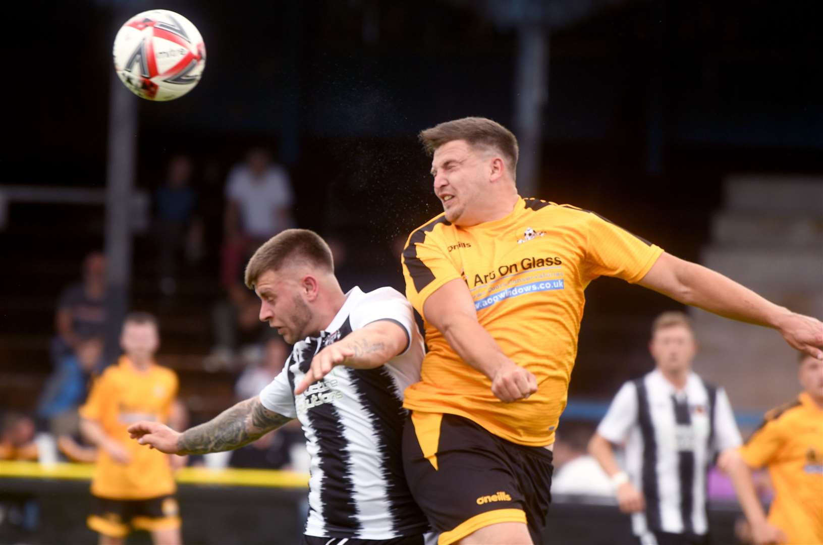 A familiar sight as Danny Emmington wins a header