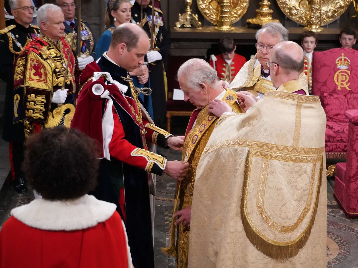 The Prince of Wales placing the Stole Royal on his father the King during his coronation ceremony (Victoria Jones/PA)