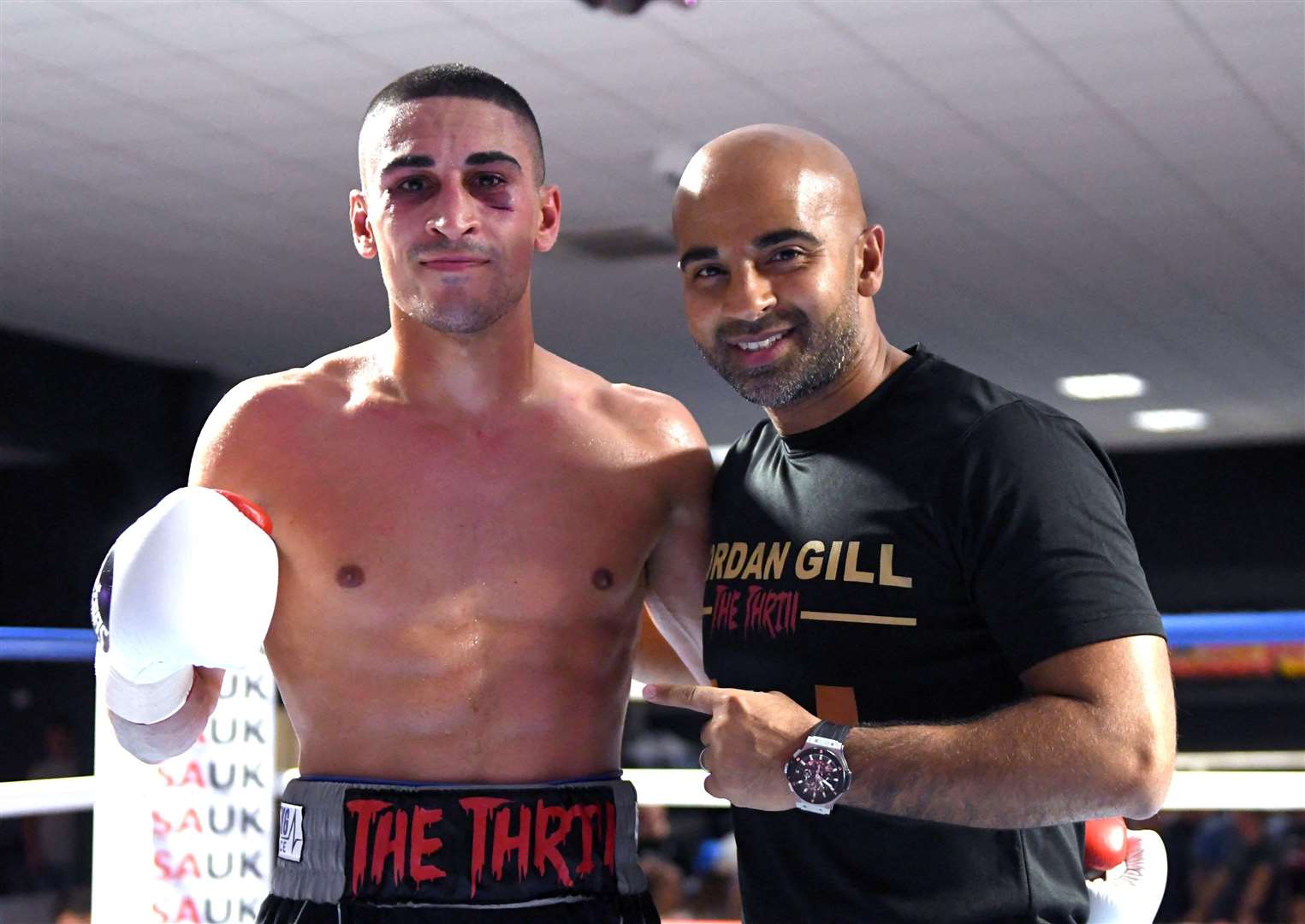 Jordan Gill, pictured here with trainer Dave Coldwell, now has his eyes on title fights after his latest win