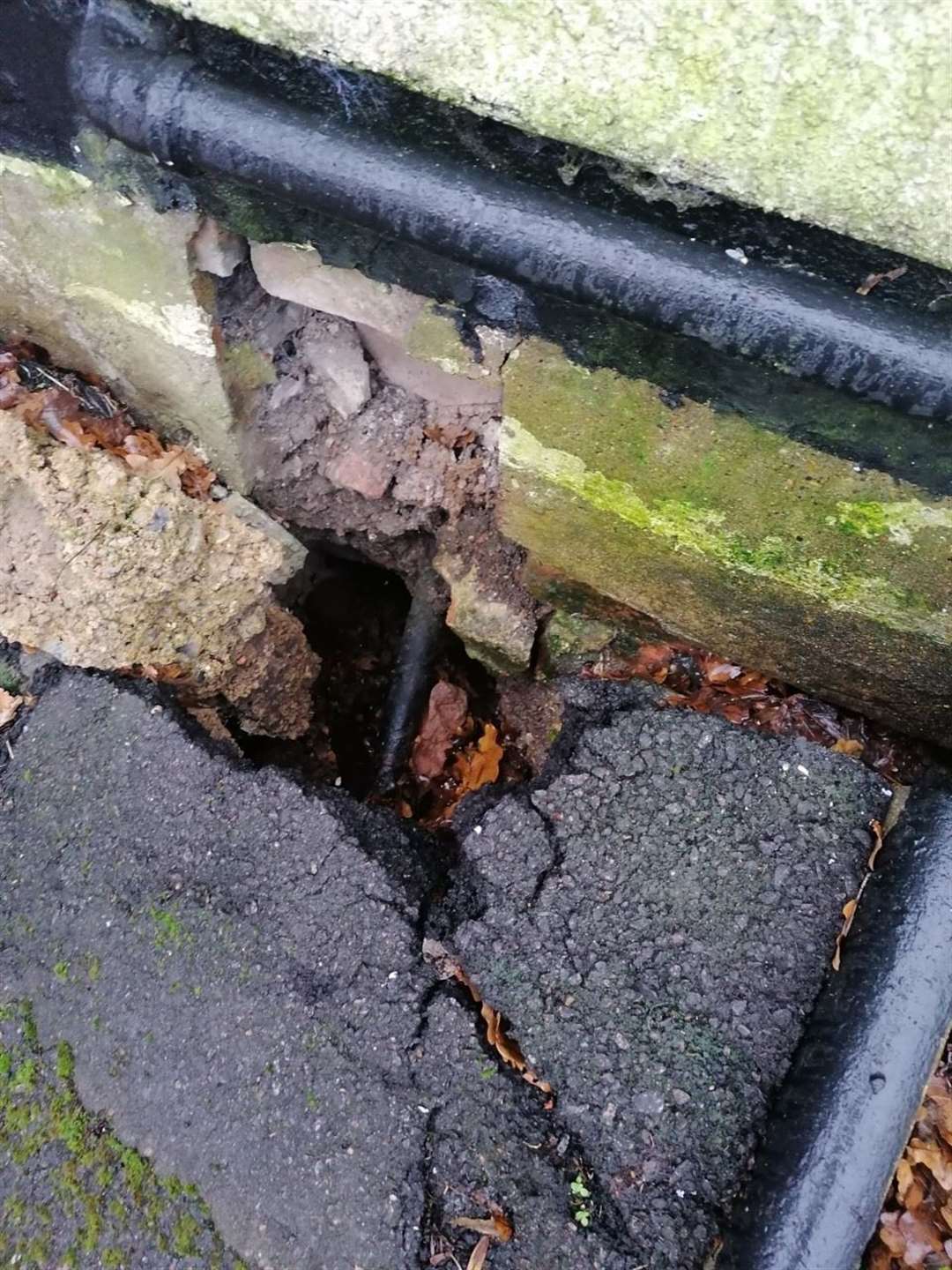 There is a gaping hole under Chris and Tessa Stone's house. (43350665)