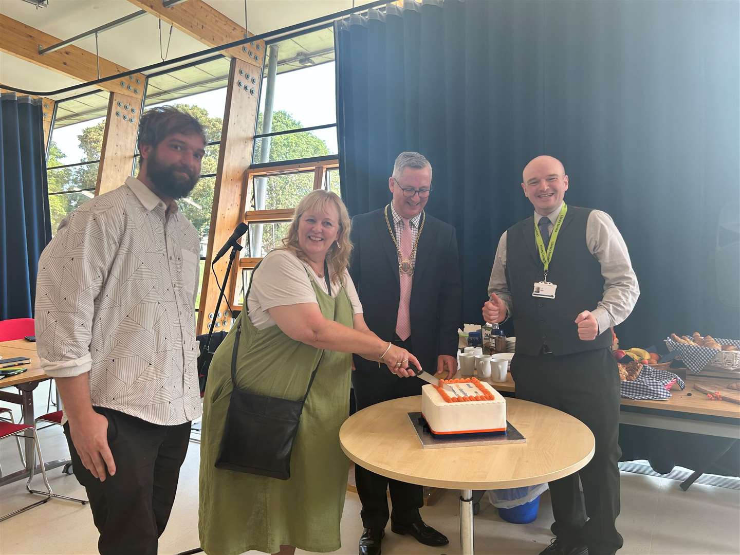 The cake was cut at the opening for everyone to tuck into