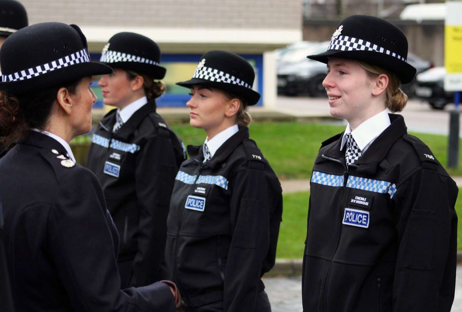 Fourteen new police officers celebrated the start of the new year today by passing out in front of family and friends.