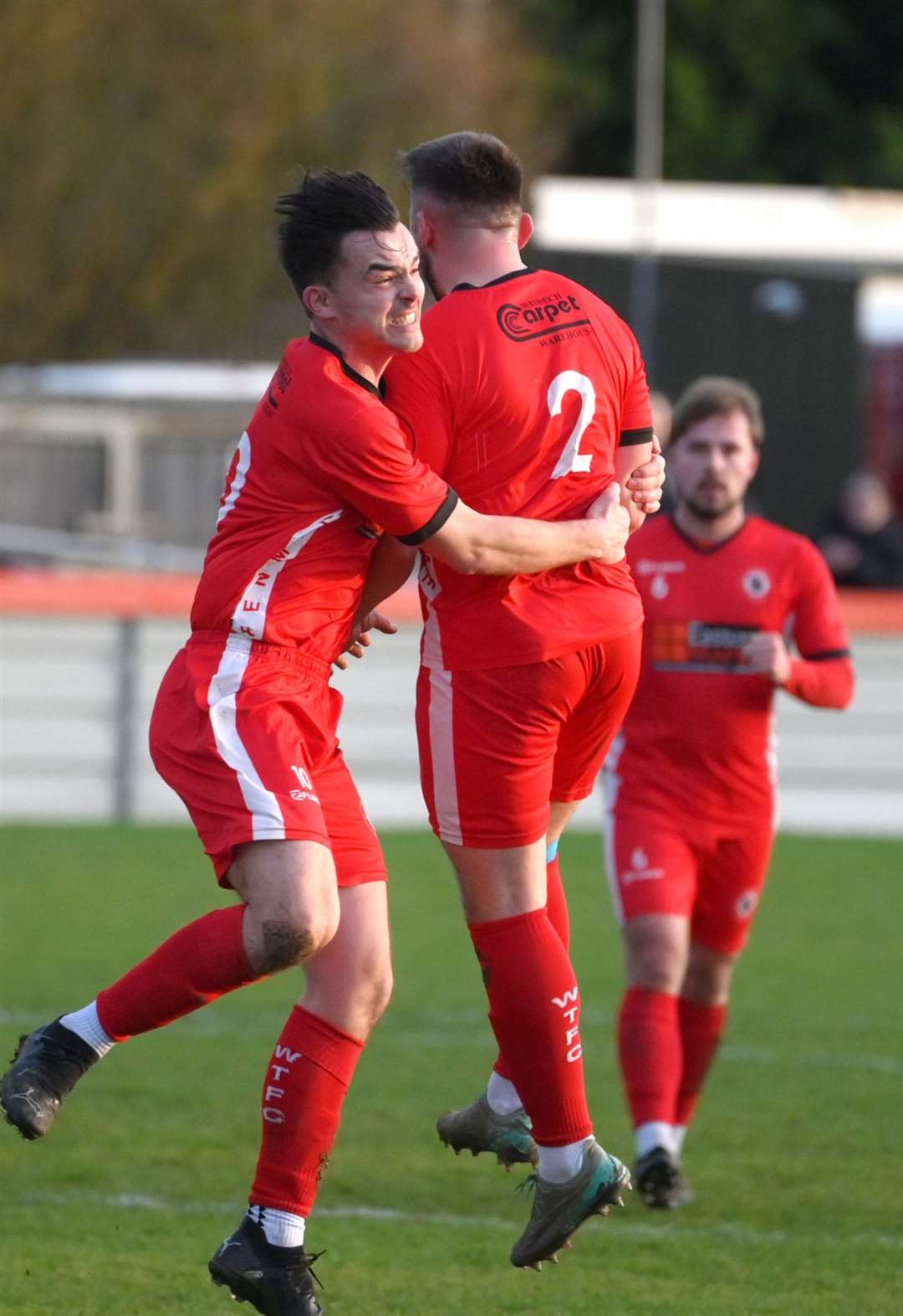 Wisbech Town celebrate their equaliser from Joe Reed (right)