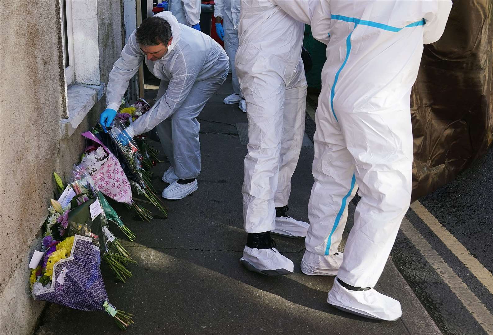 Members of the Garda forensics at the scene in Youghal, Co Cork (Brian Lawless/PA)