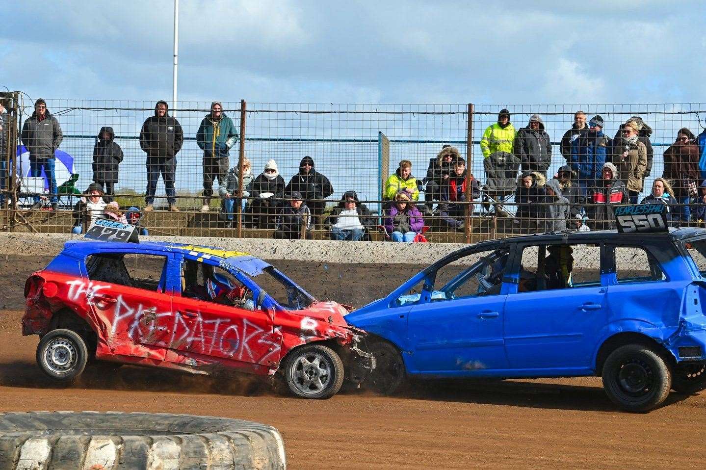 479 Joel Allen squares up to Phil Jackson for a big head-on in the 1600cc bangers. Picture Jim Harrod