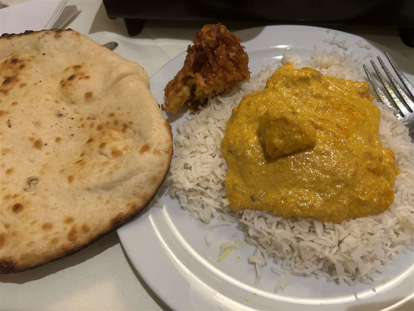 My chicken korma with boiled rice and my peshwari naan