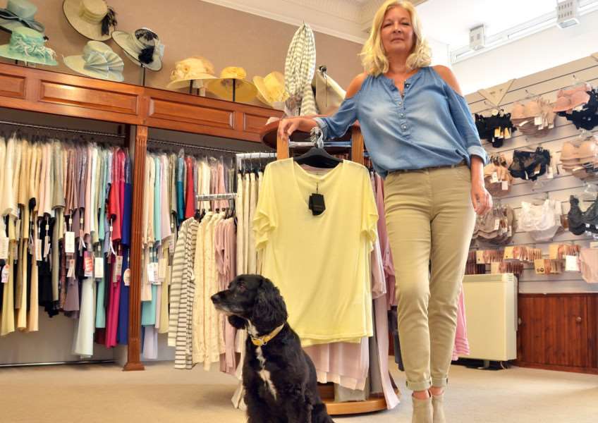 STYLE FACTORY: Elaine Tunnard and Jessie the cocker spaniel at Sheila Tiller Fashions in Long Sutton. Photo by Tim Wilson.''SG130617-105TW.