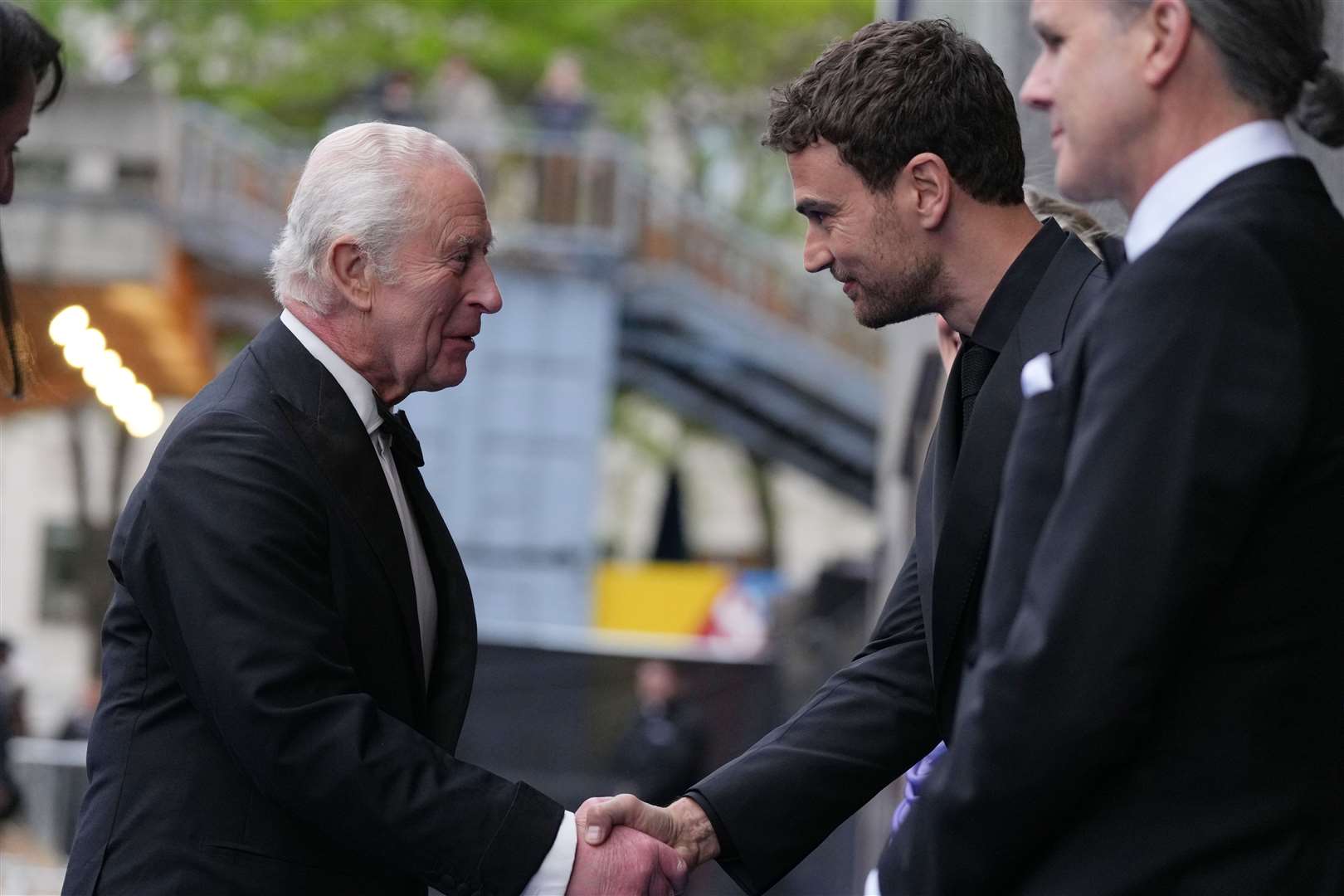 Charles chatted with actor Theo James, who was among the guests at the premiere (Alistair Grant/PA)