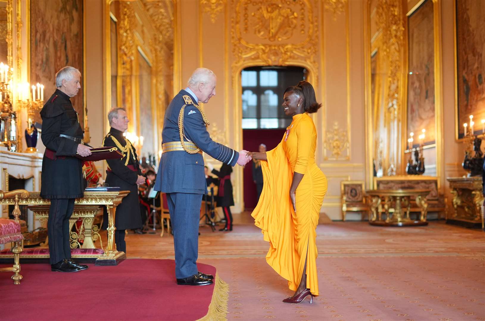 Dina Asher-Smith is made a Member of the Order of the British Empire by the King at Windsor Castle (Jordan Pettitt/PA)