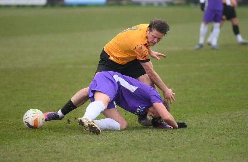 Jack Saunders battles for possession