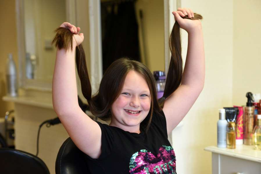 Kelsey Allington 10 having her hair cut for national autistic society and has raisied �250 and hair to Little Princess Trust
