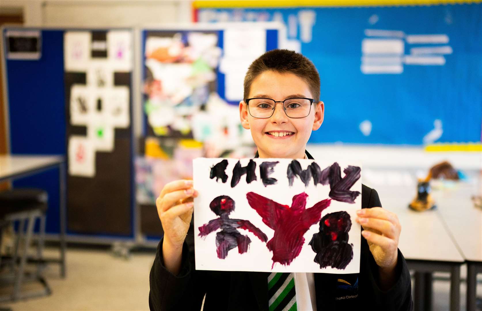 A pupils with his artwork.Photo: Ian Burt/Barking Dog Media.