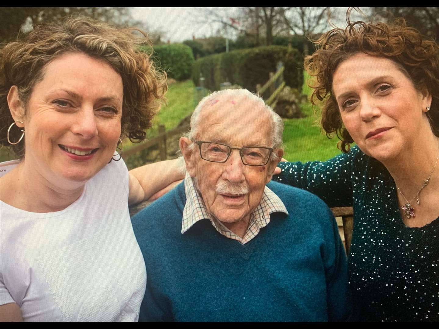 Captain Tom Moore with his two daughters Lucy and Hannah.