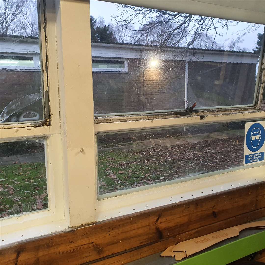 Peeling paint on a window sill. DEC 2024
