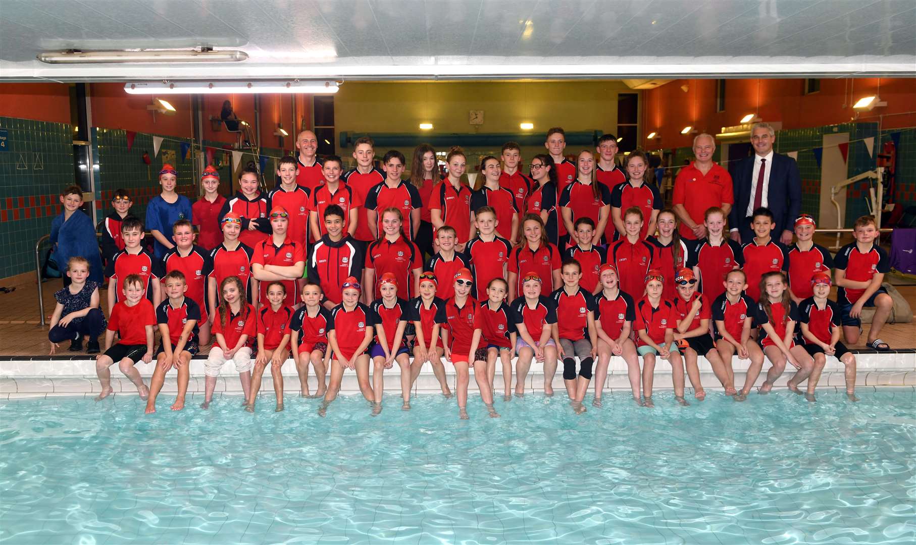 MP Steve Barclay presented medals and trophies at one of Wisbech Swimming Club’s 2019 Club Championship galas. Photo: ADAM FAIRBROTHER