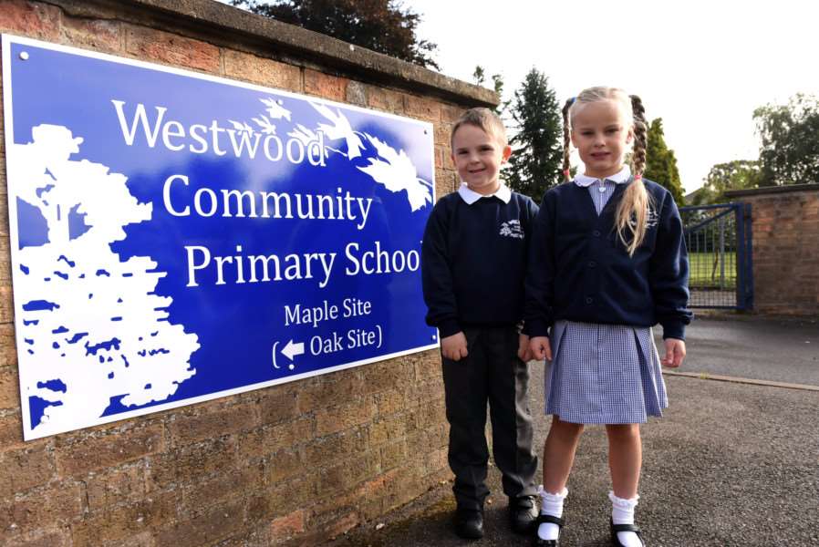 Rhys Buck, 5, and Ellie Fiveash, 6, pictured at March's Westwood Primary School when it opened its doors for the first time on Thursday.